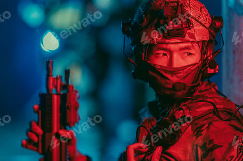 Preview: Military tactical team operates under red light at night inside dark abandoned building