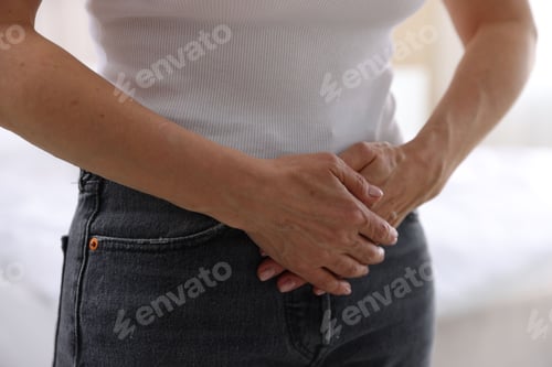 Preview: Menopause. Woman suffering from abdominal pain at home, closeup
