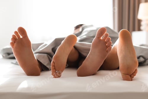 Preview: Lovely couple having sex in bed at home, closeup