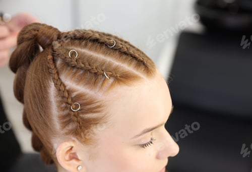 Preview: Teenage girl with beautiful braids in salon, closeup