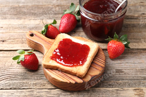 Preview: Toasted bread with strawberry jam and fresh berries on wooden table, closeup