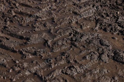 Preview: Muddy road with tire tracks as background, closeup