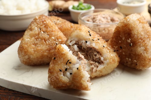 Preview: Delicious Yaki Onigiri (grilled rice balls) served on wooden table, closeup
