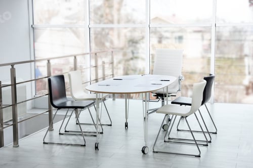 Preview: Stylish chairs and table in office. Interior design