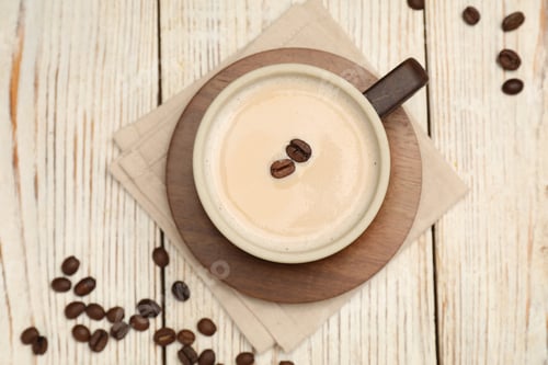 Preview: Aromatic coffee in cup and beans on wooden table, flat lay
