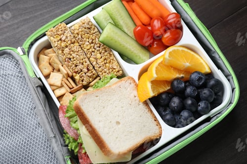 Preview: Lunch box with tasty food on table, top view