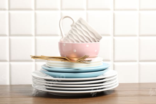 Preview: Beautiful ceramic dishware, cup and cutlery on wooden table