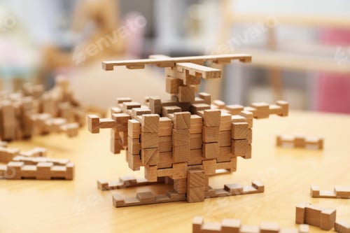Preview: Helicopter made of wooden blocks on table indoors, closeup