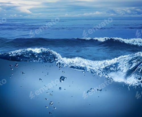 Preview: Sea water surface and underwater view. Sky with clouds above