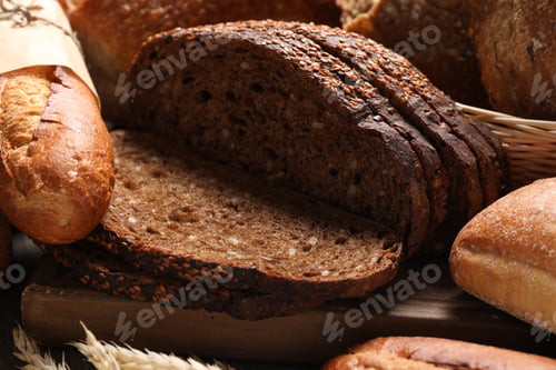 Preview: Different types of bread and spikes on table, closeup