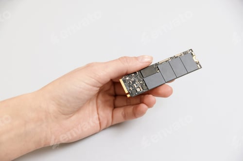Preview: Woman with SD RAM on light background, closeup