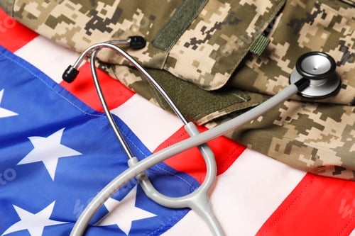 Preview: Stethoscope and military uniform on USA flag, closeup