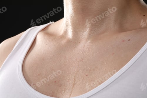 Preview: Young guy with sweat on his body against black background, closeup