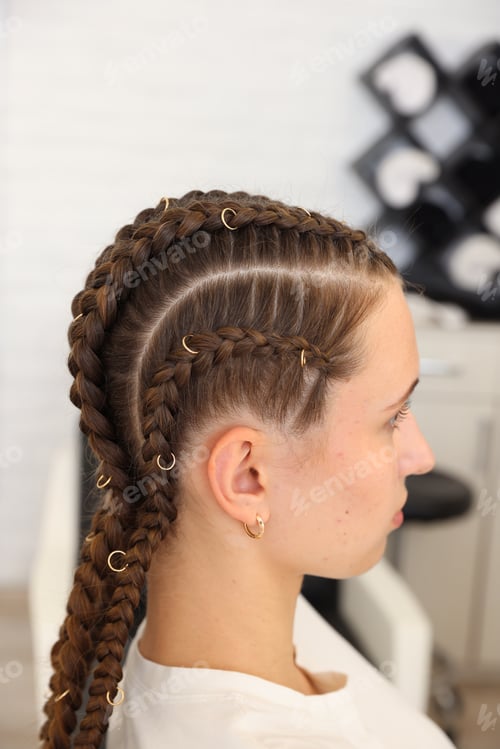 Preview: Teenage girl with beautiful braids in salon