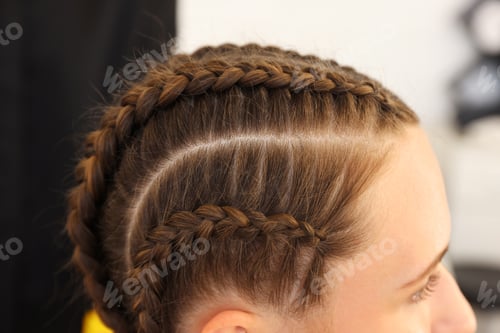 Preview: Teenage girl with beautiful braids indoors, closeup