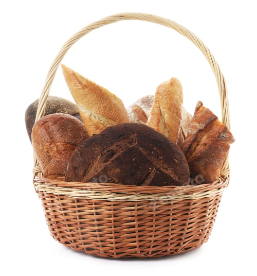 Preview: Different types of bread loaves in wicker basket isolated on white