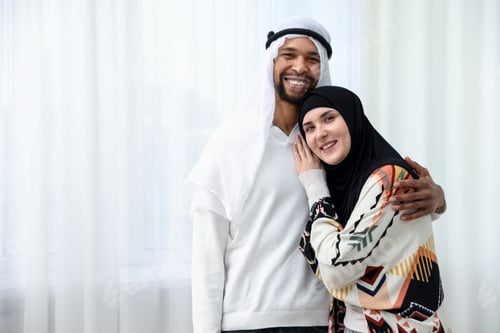 Preview: Portrait of happy muslim couple at home. Space for text
