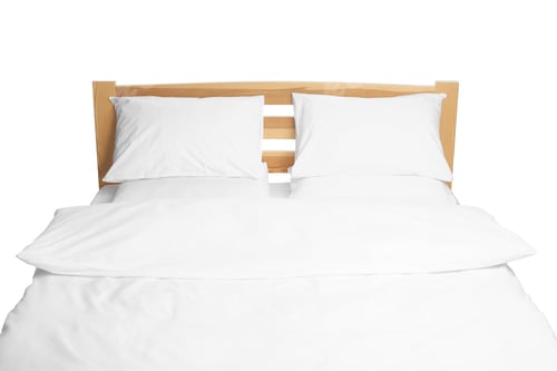 Preview: Comfortable bed with clean linens isolated on white