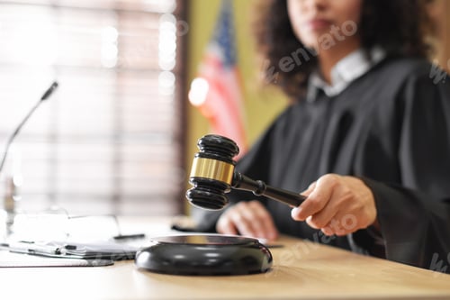 Preview: Judge striking gavel at wooden desk indoors, closeup