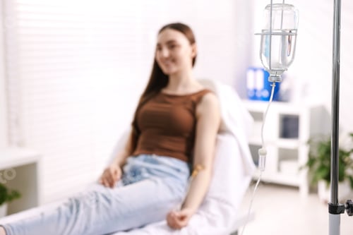 Preview: Woman with IV drip in hospital, selective focus