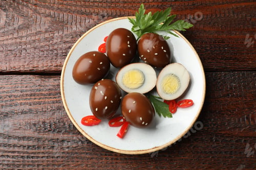 Preview: Pickled quail eggs on wooden table, top view
