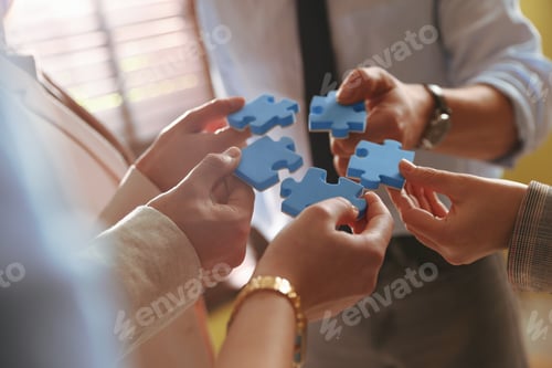 Preview: Team building. Group of businesspeople putting puzzle pieces together indoors, closeup