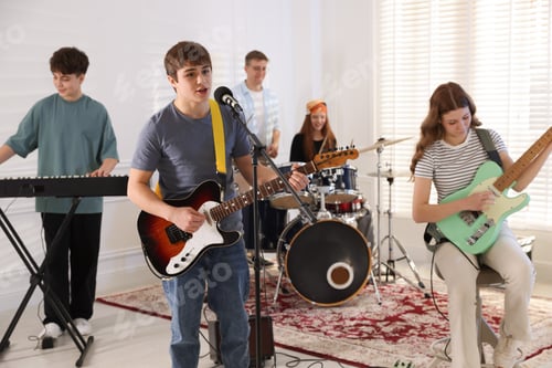 Preview: Teenage music band practicing their performance indoors