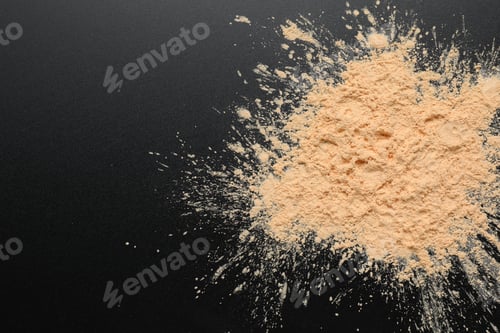 Preview: Sample of loose face powder on black background, top view. Space for text