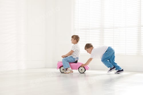 Preview: Little children with toy car at home, space for text