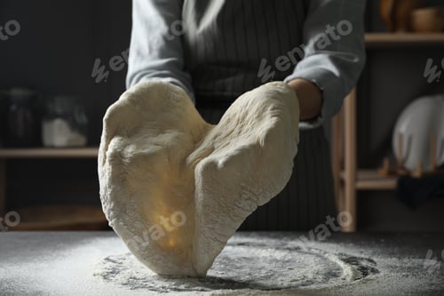 Preview: Woman making pizza dough at table, closeup