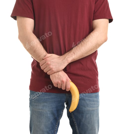 Preview: Urology. Man with banana on white background, closeup