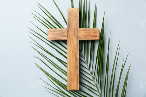 Preview: Easter attributes. Wooden cross and palm leaf on light grey background, top view
