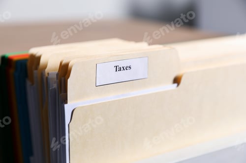 Preview: Tax. Many folders in drawer of cabinet in office, closeup