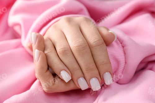 Preview: Woman showing her manicured hands with color nail polish, closeup