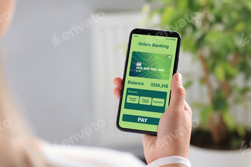 Preview: Online payment. Woman using banking app on smartphone indoors, closeup