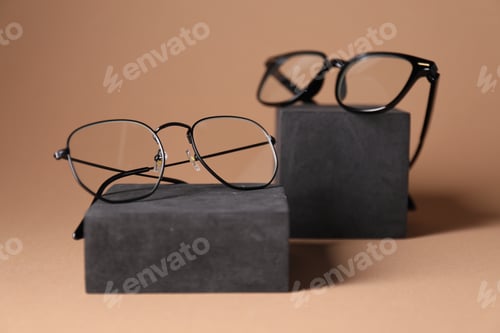 Preview: Stylish presentation of eyeglasses on brown background, closeup