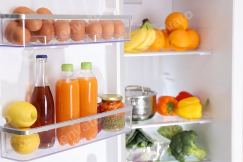 Preview: Modern refrigerator with different fresh food products, closeup