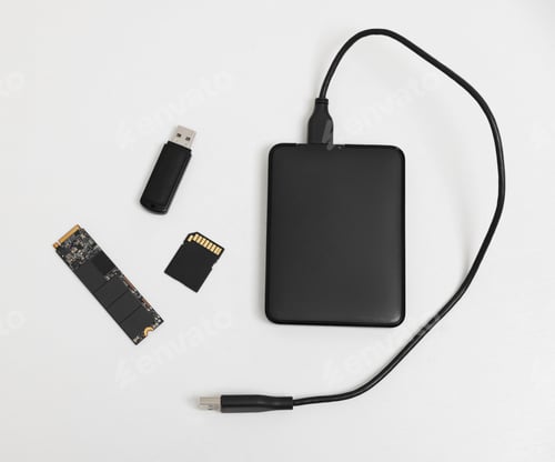 Preview: Different modern storage devices on white background, flat lay