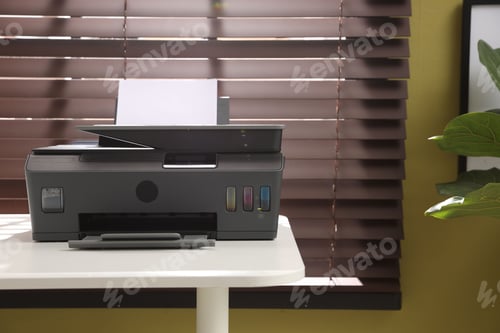 Preview: Modern printer on white desk indoors, space for text