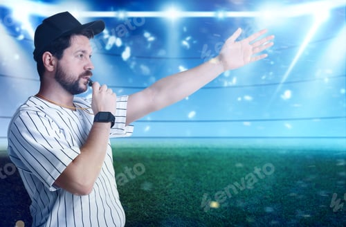 Preview: Referee in uniform blowing whistle at stadium