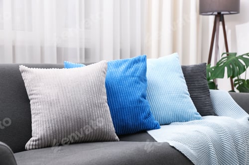 Preview: Soft cushions in colorful pillowcases on sofa indoors