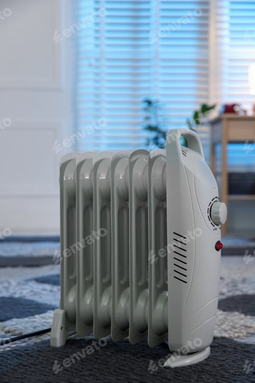 Preview: Modern portable electric heater on floor indoors