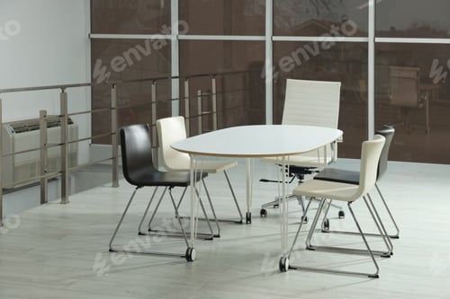 Preview: Stylish chairs and table in office. Interior design