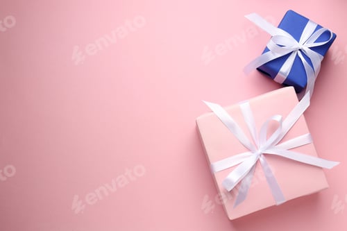 Preview: Wrapped gifts with bows on light pink background, flat lay. Space for text