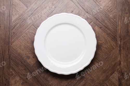 Preview: Empty plate on wooden table, top view