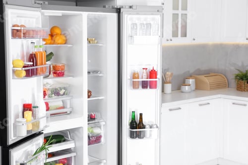 Preview: Modern refrigerator with different fresh food products in kitchen, space for text
