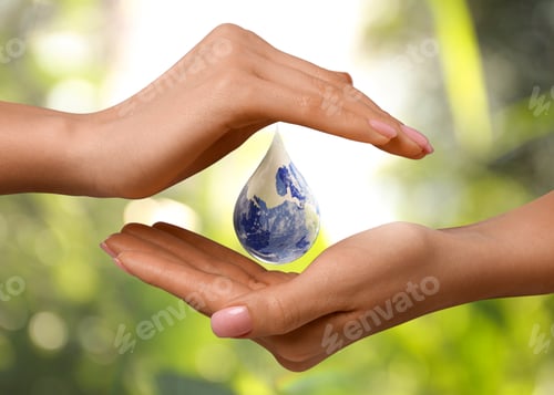Preview: Water conservation. Drop with Earth globe inside between woman's hands against blurred green backgro