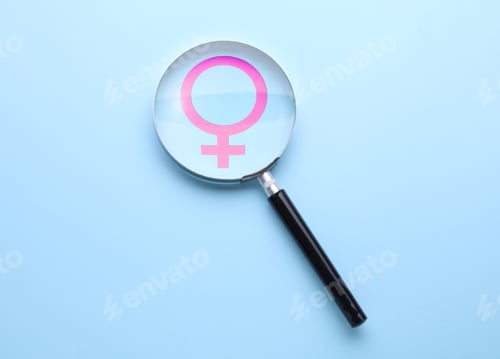 Preview: Female gender symbol and magnifying glass on light blue background, top view