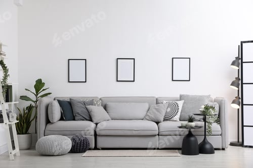 Preview: Stylish modular sofa, houseplants and furniture in room. Interior design