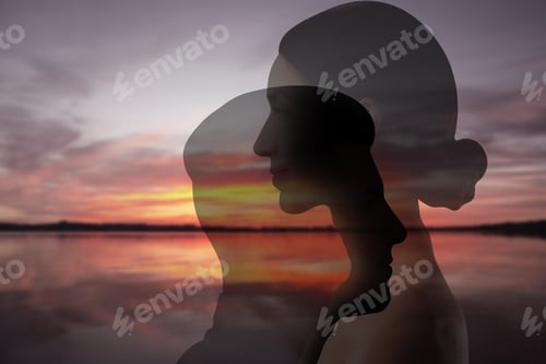 Preview: Silhouettes of man and woman against seascape at sunset. Love, bonding, relationships